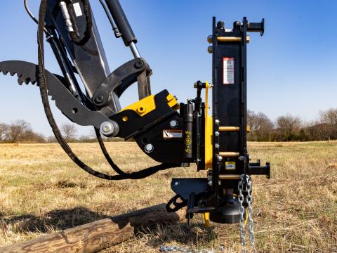 Image showing Side view of Danuser Hornet T8-RR post driver on Mini John Deere 50P Excavator with chain and a fallen wood post