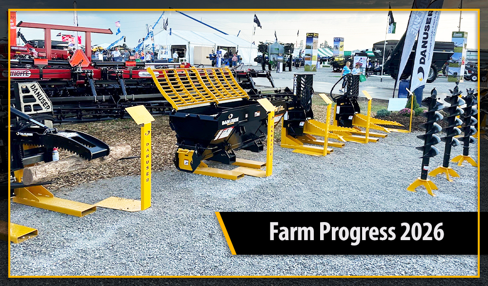 Danuser Attachments sitting on a gravel lot at the Farm Progress Show. To the left is the Mega Mixer, Middle is the Intimidator, and to the right are some auger bits. A banner comes in from the right with text that says Farm Progress Show 2026